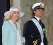  Au bras du prince Carl Philip de Suède, parrain de sa nièce la princesse Estelle, Anna Westling Söderström, soeur du prince Daniel et marraine d'Estelle. 
 La princesse Estelle de Suède, fille de la princesse Victoria et du prince Daniel, a reçu le baptême le 22 mai 2012, à la veille de ses 3 mois, en la chapelle royale du palais Drottningholm, à Stockholm. 