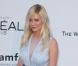 Kirsten Dunst en Louis Vuitton à la soirée de l'amfAR, au Festival de Cannes le 24 mai 2012.