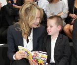 Sharon Stone et son fils Quinn au défilé Dior Homme Printemps-Eté 2013 au Tennis Club de Paris, le 30 juin 2012.