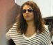 Mila Kunis arrive à un restaurant de Los Angeles avec Ashton Kutcher, le 30 juin 2012.