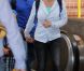Britney Spears et son garde du corps arrivent à l'aéroport de Maui à Hawaï, en famille, le dimanche 1er juillet 2012.