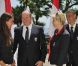 Albert et Charlene avec Angélique Trinquier, nageuse spécialiste du 100 m dos et porte-drapeau. Le prince Albert de Monaco et la princesse Charlene procédaient le 12 juillet 2012 à la présentation de la délégation olympique monégasque pour les JO de Londres 2012, à l'Hôtel Hermitage. Six athlètes porteront les couleurs de la principauté.