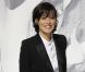 Inès de la Fressange, chic et souriante lors du défilé prêt-à-porter de Chanel. Paris, octobre 2011.