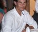 Rafael Nadal, avec sa compagne Xisca Perello, était l'invité du roi Juan Carlos Ier d'Espagne le 10 août 2012 au restaurant Flanigan, à Majorque.