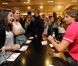 Camille Lacourt pose en compagnie de ses fans aux Galeries Lafayette, à Paris, samedi 1er septembre 2012.