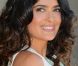 Salma Hayek pose devant la cabine de plage à son nom à Deauville, le 8 septembre 2012