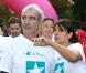 Raymond Domenech et Estelle Denis lors de la 10e édition de de la course Odyssea au profit de de la lutte contre le cancer du sein au château de Vincennes le 7 Octobre 2012
