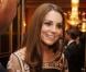 Kate Middleton rayonnante lors d'une réception donnée à Buckingham Palace le 23 octobre 2012 en l'honneur des médaillés olympiques et paralympiques des Jeux olympiques de Londres