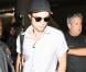 Kristen Stewart et Robert Pattinson sortent séparément de l'aéroport de Los Angeles le 25 octobre 2012. K-Stew venait du Japon et R-Patz d'Australie