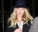 Rosie Huntington-Whiteley, stylée à son arrivée à l'aéroport de Los Angeles avec Jason Statham, porte ses pièces fétiches : un sac Nightingale de Givenchy et des bottines Isabel Marant. Le 10 décembre 2012.