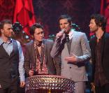 Les Take That : Gary Barlow, Mark Owen, Jason Orange, Howard Donald