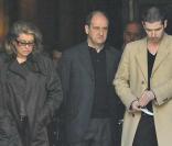 Catherine Deneuve, Pierre Lescure et Melvil Poupaud à la sortie de l'église