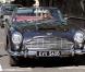 Elle MacPherson au volant de son Aston Martin vintage 