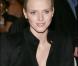 Charlene Wittstock en chemise à épaulettes noire, le 1er décembre 2007. Sobre et engagée, elle assiste à une vente aux enchères organisée au profit de Fight Aids Monaco. 