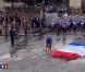 Défilé du 14 juillet 2010, sur les Champs-Elysées, à Paris. Le beau temps n'est pas au rendez-vous. 