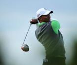 Toujours en quête d'un 15e succès dans un tournoi majeur, Tiger Woods peine à retrouver les sommets depuis le scandale de ses infidélités conjugales... Le british Open de Saint Andrews (photo le 16 juillet) ne fait pas exception.