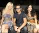 Victoria Silvstedt et Enrico Papi lors du défilé "Miss Bikini" dans le cadre de la Fashion Week de Milan, le 22 septembre 2010
