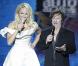 Pamela Anderson anime la première édition de l'EuroVoice, à Athènes (Grèce), aux côtés d'Eric Serra, vendredi 24 septembre.