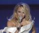 Pamela Anderson anime la première édition de l'EuroVoice, à Athènes (Grèce), aux côtés d'Eric Serra, vendredi 24 septembre.