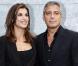 Elisabetta Canalis et George Clooney au défilé Giorgio Armani à Milan le 27 septembre 2010