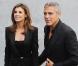 Elisabetta Canalis et George Clooney au défilé Giorgio Armani à Milan le 27 septembre 2010