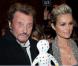Leaticia et Johnny Hallyday à la présentation des poupées frimousses au Grand Palais avec la poupée de Damien Hirst