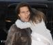 Tom Cruise et Katie Holmes arrivent à l'hôtel Plaza avec leur fille Suri, court vêtue par -4°C, lundi 20 décembre, à New York.