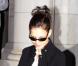 Tom Cruise et Katie Holmes quittent l'hôtel Plaza avec leur fille Suri, court vêtue par -4°C, lundi 20 décembre, à New York.
