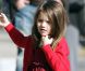 A trois ans et demi, la petite Suri Cruise se prend déjà pour une star avec ses mini talons (elle a lancé la tendance) et sa belle robe de princesse. Boston, 26 octobre 2009