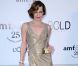 Milla Jovovich est radieuse dans sa robe Versace lors de la célèbre soirée caritative de l'amFar organisée à Antibes lors du 64ème Festival de Cannes, 19 mai 2011