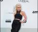 Gwen Stefani est radieuse dans sa robe signée de sa marque L.A.M.B., lors de la célèbre soirée caritative de l'amFar organisée à Antibes lors du 64ème Festival de Cannes, 19 mai 2011