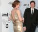 Milla Jovovich est radieuse dans sa robe Versace lors de la célèbre soirée caritative de l'amFar organisée à Antibes lors du 64ème Festival de Cannes, 19 mai 2011