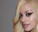 Zahia Dehar : la créatrice prend quelques minutes en backstage de son défilé Printemps-Été 2012 au Palais Chaillot le 25 janvier 2012 à Paris