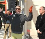 Philippe Starck fier de poser la première brique de son nouveau restaurant aux puces de Saint-Ouen, le 21 mars 2012