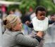 Jackson Theron, le fils de Charlize Theron, en compagnie de Gerda la mère de l'actrice, une nounou et un garde du corps, à Paris le 9 mai 2012