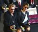 Très chargés, Johnny Hallyday, Laeticia et leurs fillettes arrivent à Paris depuis Los Angeles, le 5 mai 2012.