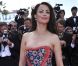 Bérénice Bejo, rayonnante dans sa tenue Prada, électrise les photographes du Palais des Festivals avant d'assister à la projection du film Lawless. Cannes, le 19 mai 2012.