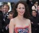Bérénice Bejo, rayonnante dans sa tenue Prada, électrise les photographes du Palais des Festivals avant d'assister à la projection du film Lawless. Cannes, le 19 mai 2012.