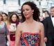 Bérénice Bejo, rayonnante dans sa tenue Prada, électrise les photographes du Palais des Festivals avant d'assister à la projection du film Lawless. Cannes, le 19 mai 2012.
