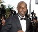 Jimmy Jean Louis en smoking sur le tapis rouge du Palais des Festivals pour la projection du film Lawless. Cannes, le 19 mai 2012.
