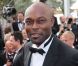 Jimmy Jean Louis en smoking sur le tapis rouge du Palais des Festivals pour la projection du film Lawless. Cannes, le 19 mai 2012.