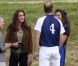 Kate Middleton, duchesse de Cambridge, assiste avec son chien Lupo à un match caritatif de polo auquel les princes William et Harry participent, à Westonbirt, le 17 juin 2012. Kate félicite son mari le prince William