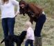 Kate Middleton, duchesse de Cambridge, assiste avec son chien Lupo à un match caritatif de polo auquel les princes William et Harry participent, à Westonbirt, le 17 juin 2012. Ici avec la petite Savannah, fille de Peter et Autumn Phillips