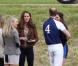 Kate Middleton, duchesse de Cambridge, assiste avec son chien Lupo à un match caritatif de polo auquel les princes William et Harry participent, à Westonbirt, le 17 juin 2012. Kate félicite son mari le prince William