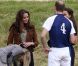Kate Middleton, duchesse de Cambridge, assiste avec son chien Lupo à un match caritatif de polo auquel les princes William et Harry participent, à Westonbirt, le 17 juin 2012. Kate félicite son mari le prince William