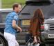 Kate Middleton, duchesse de Cambridge, assiste avec son chien Lupo à un match caritatif de polo auquel les princes William et Harry participent, à Westonbirt, le 17 juin 2012. Kate félicite son mari le prince William