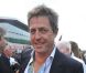 Hugh Grant dans le paddock du Grand Prix de Formule 1 de Grande Bretagne à Silverstone le 8 juillet 2012
