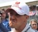 Michael Schumacher dans le paddock du Grand Prix de Formule 1 de Grande Bretagne à Silverstone le 8 juillet 2012