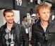 Matthew Bellamy et Dominic Howard dans le paddock du Grand Prix de Formule 1 de Grande Bretagne à Silverstone le 8 juillet 2012