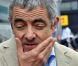 Rowan Atkinson dans le paddock du Grand Prix de Formule 1 de Grande Bretagne à Silverstone le 8 juillet 2012